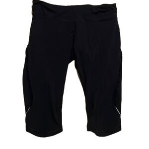 Lululemon size 10 capris with ruffle detail on side and back pocket with zipper
